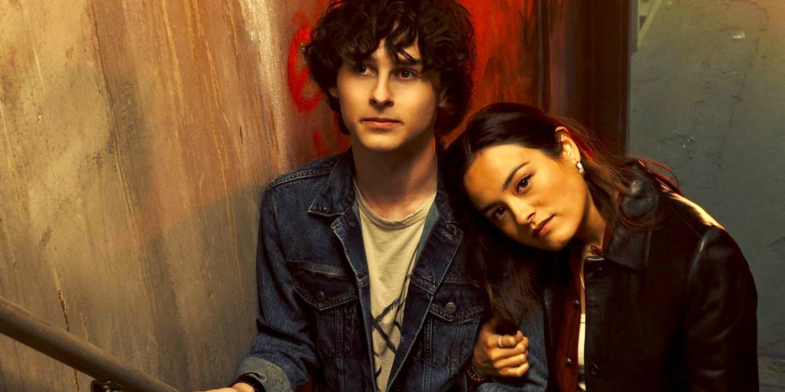 City on Fire cast members leaning on each other