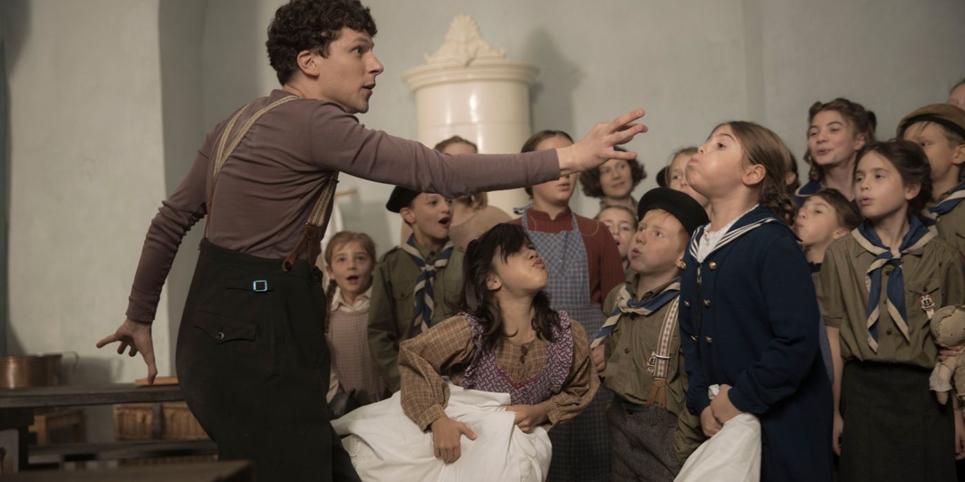 Jesse Eisenberg mimes in front of children in Resistance