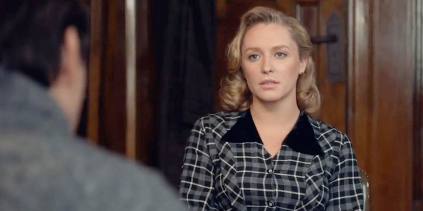 Annie Starke looks serious in The Wife