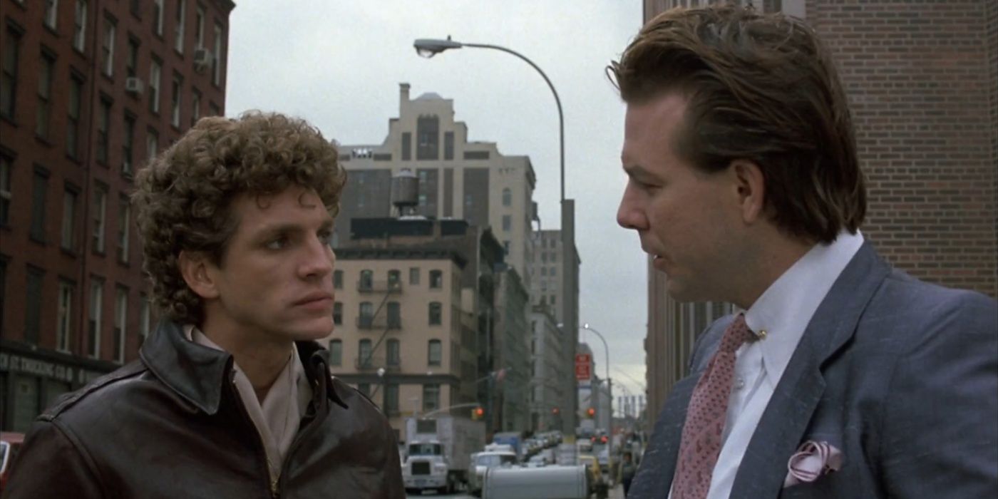 Two men talk on the street in The Pope of Greenwich Village