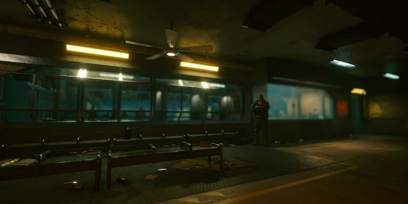 A shot of the shooting range in Cyberpunk 2077’s Shoot To Thrill side quest, with Wilson standing off to the right side.
