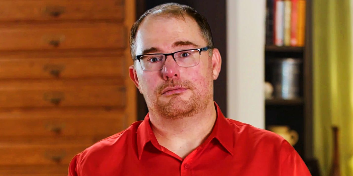 David Dangerfield from 90 Day Fiance: Before the 90 Days wearing red shirt and looking sad