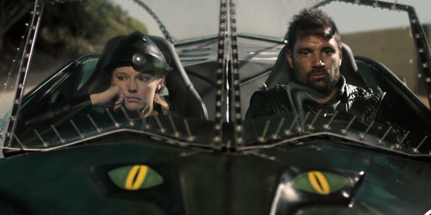 A man and woman look bored while racing in Death Race 2050