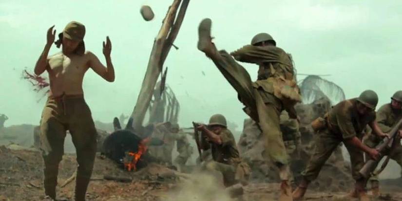 Desmond Doss (Andrew Garfield) kicking a grenade in Hacksaw Ridge's ending