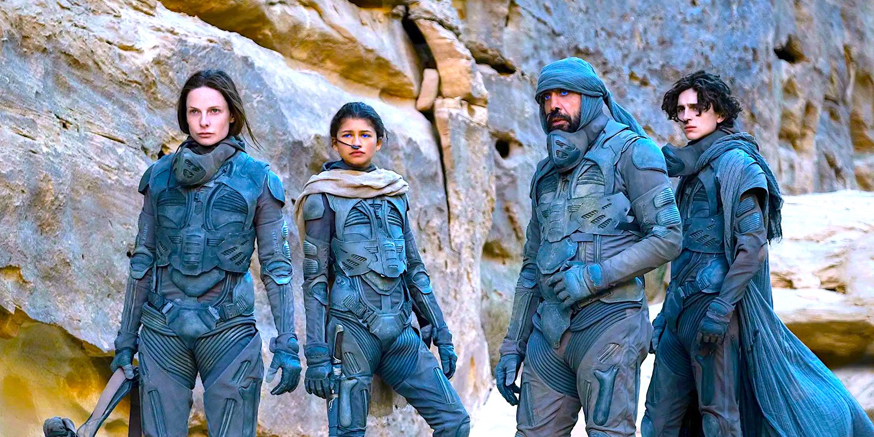 Rebecca Ferguson, Zendaya, Javier Bardem and Timotee Chalamet standing in front of rocks in Dune 1.