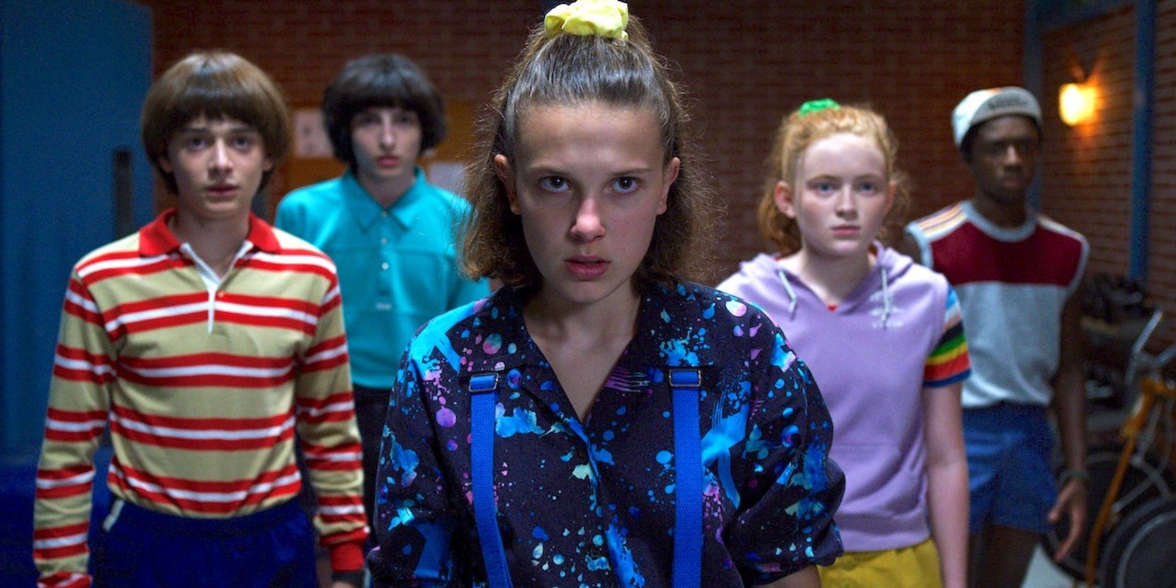 Noah Schnapp as Will, Finn Wolfhard as Mike, Millie Bobby Brown as Eleven, Sadie Sink as Max, and Caleb McLaughlin as Lucas in Stranger Things