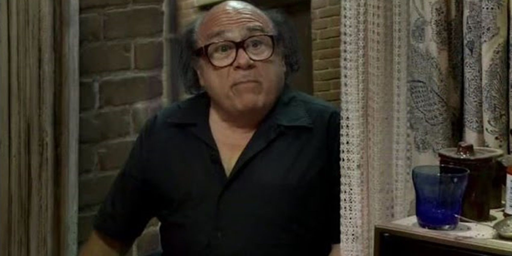 Frank sits on the window ledge in It&rsquo;s Always Sunny in Philadelphia