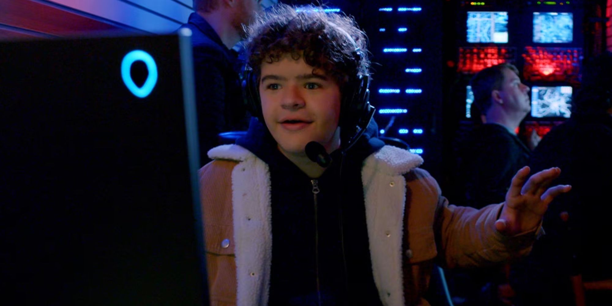 Gaten Matarazzo watching a monitor and wearing a headset in Prank Encounters