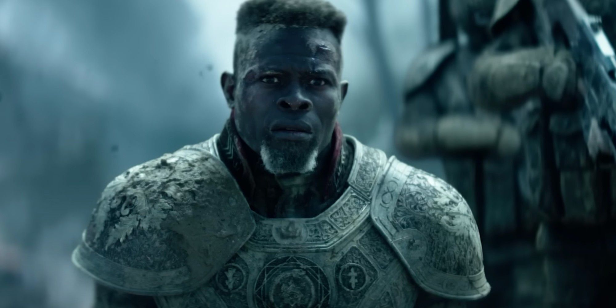 General Titus (Djimon Hounsou) wearing armor and looking worried in Rebel Moon.