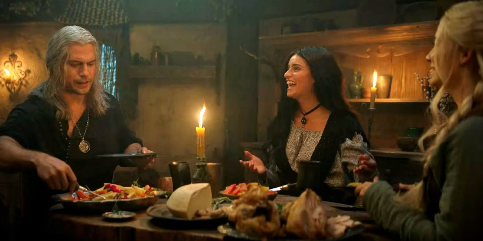 Geralt, Ciri, and Yennefer enjoy dinner together.