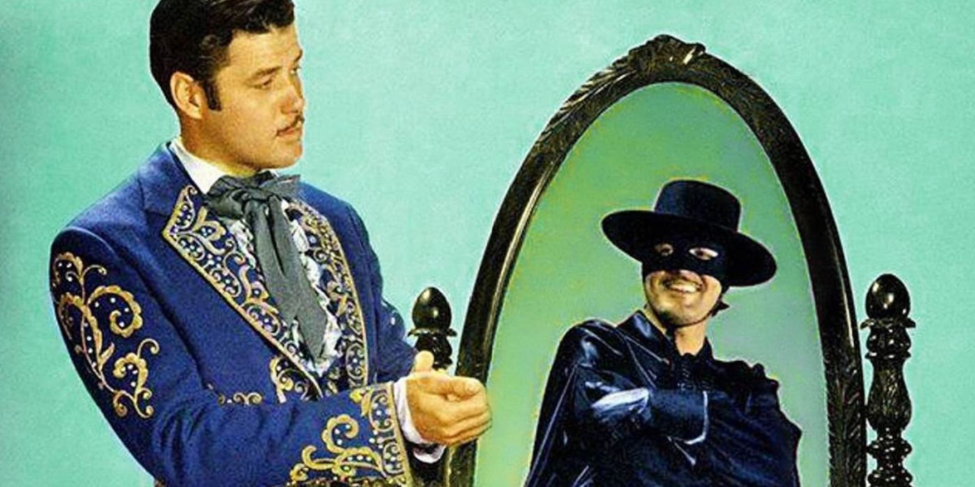 Guy Williams staring into a mirror with his masked reflection smiling at him in Zorro