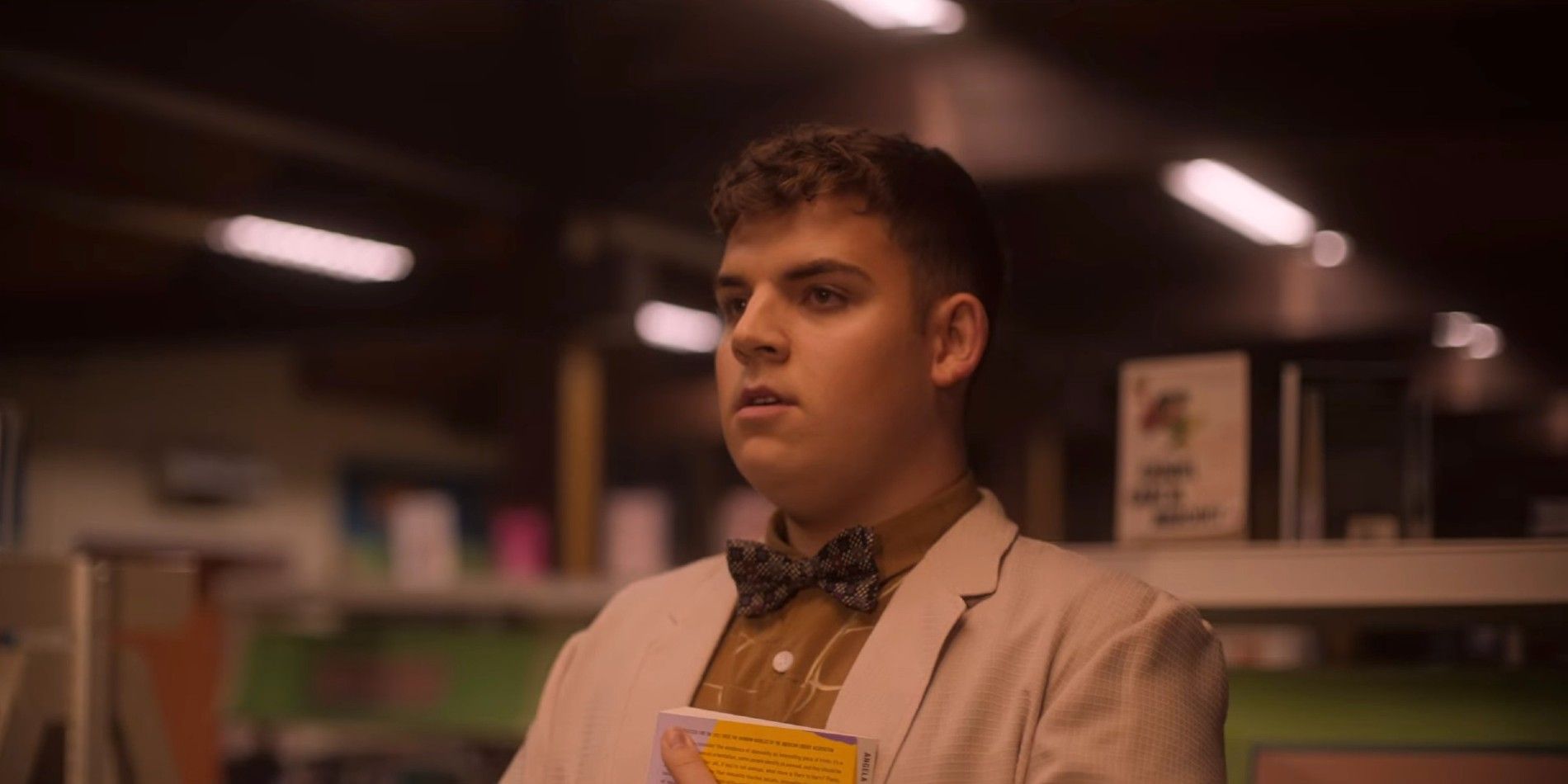 Isaac looking worried at someone off-screen in Heartstopper