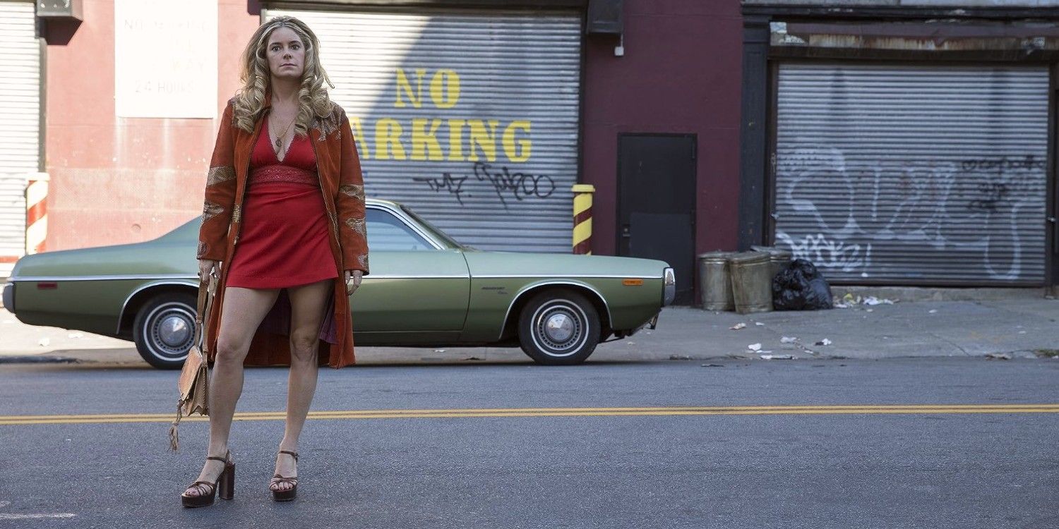 jamie-neuman-stands-on-a-street-in-the-deuce