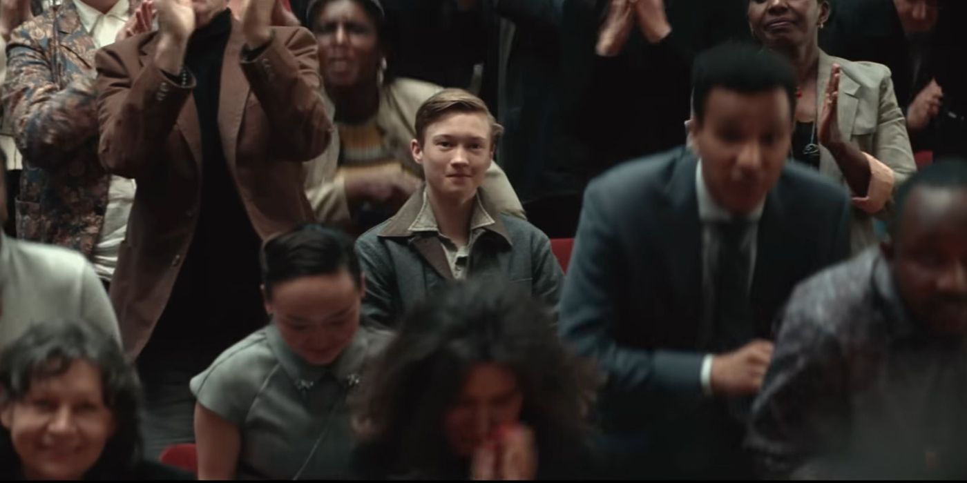 Julien standing in a crowd in White Bird