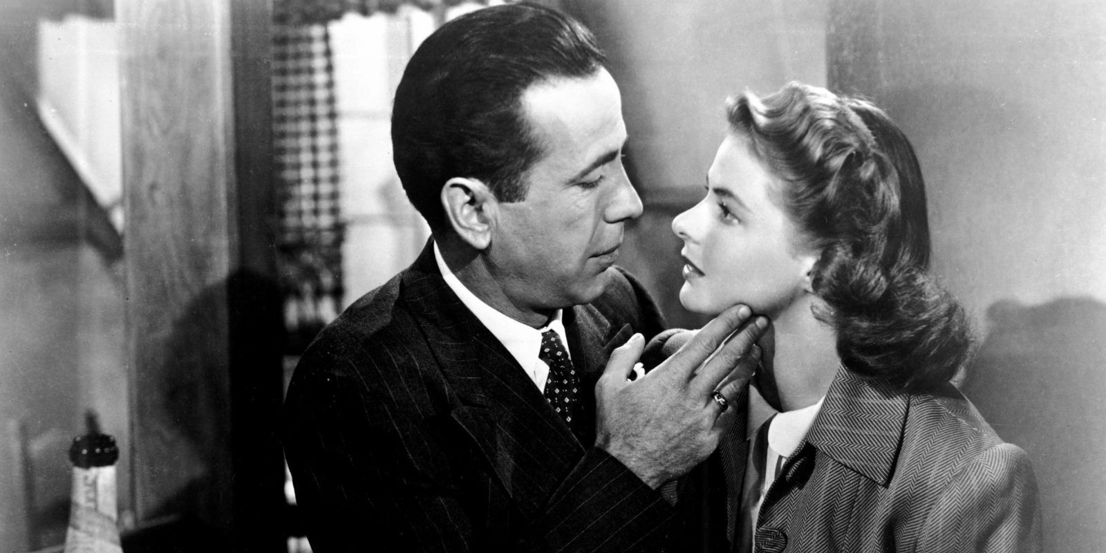 Humphrey Bogart As Rick holding Ingrid Bergman As Ilsa by her chin In Casablanca.jpg