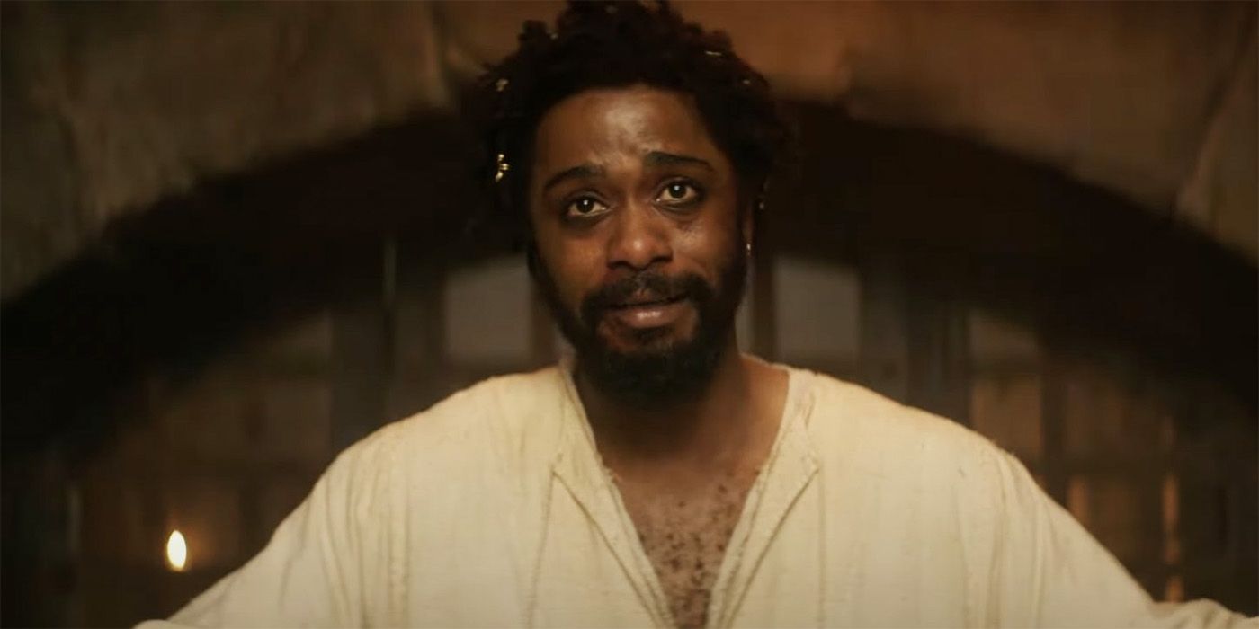 LaKeith Stanfield in The Book of Clarence with candles behind him