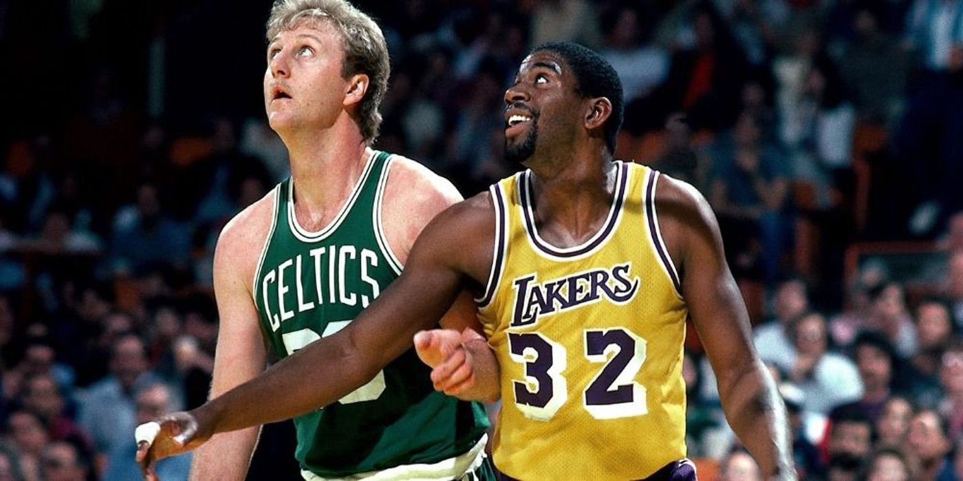 Magic Johnson and Larry Bird playing basketball