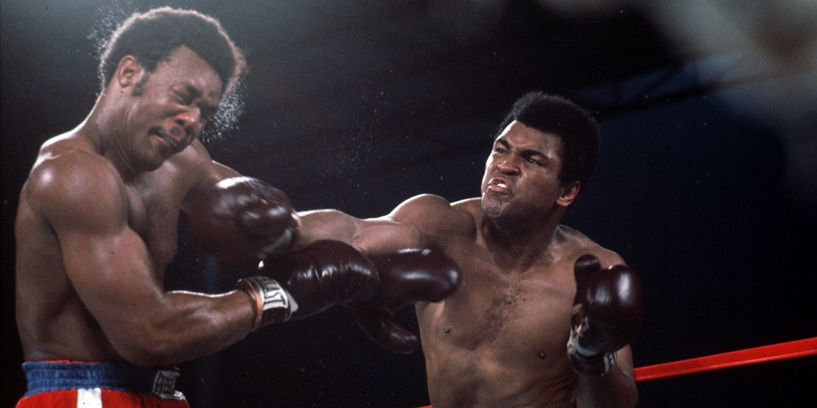 Muhammad Ali punching George Foreman in the ring