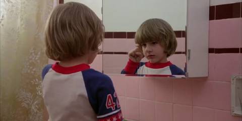 Danny talking to his imaginary friend in the mirror in The Shining.