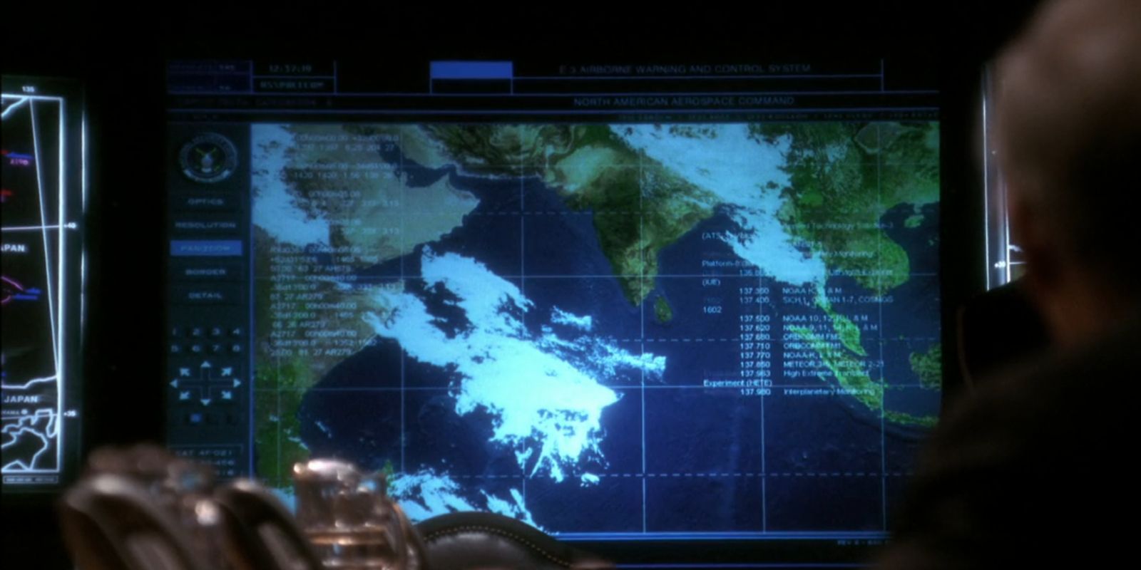 US Defense leaders look at a satellite image of a nuclear bomb test.