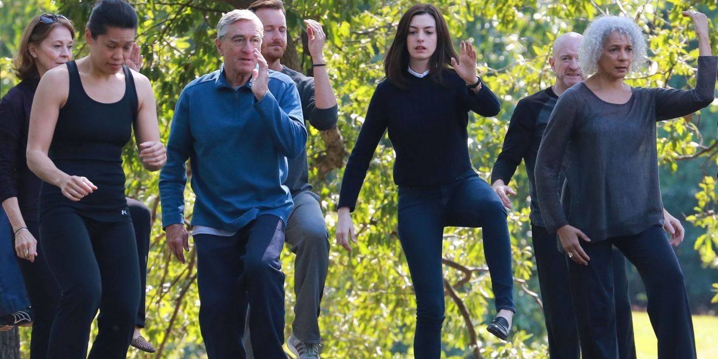Robert De Niro, Anne Hathaway, and Tiffany Chen performing tai chi in The Intern.