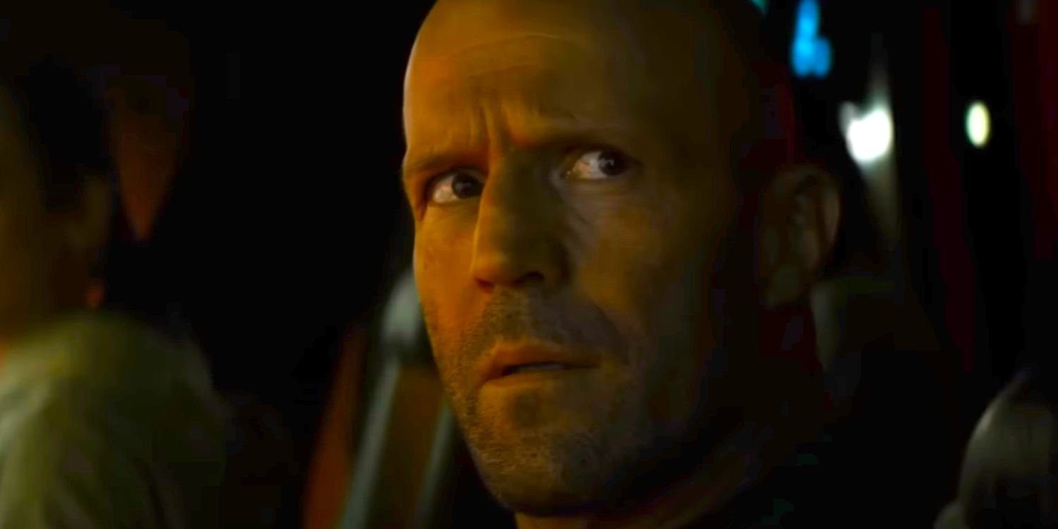 Jason Statham looking up at a Meg in Meg 2 The Trench