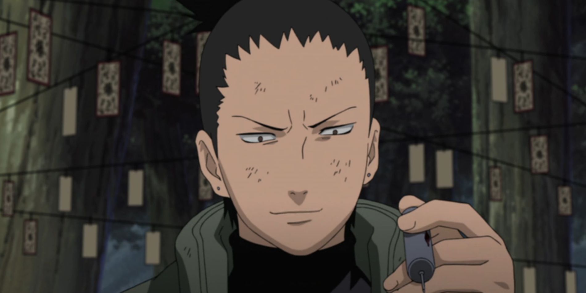 Screenshot from Naruto Shippuden anime shows Shikamaru in the forest holding a vile of blood from his immortal enemy with explosive tags strung up behind him.