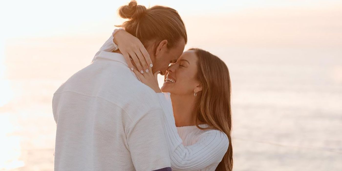 Noah Erb and Abigail Heringer from Bachelor In Paradise embracing in front of the ocean