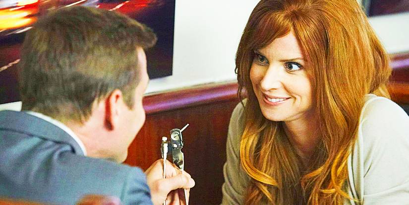 Donna looks happy while Harvey holds up a can opener in Suits