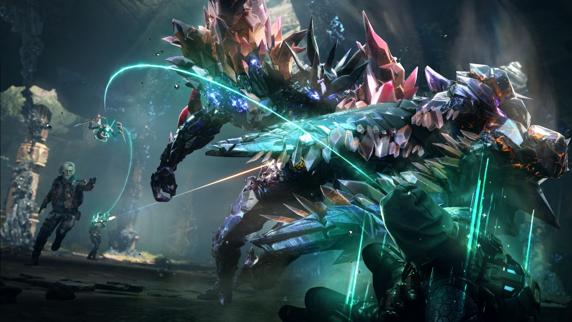 Gameplay image of SYNCED shows a team of three people fighting a huge enemy with muliplayer colored crystals sticking out of it&rsquo;s rocky extehior while a healing drone connects a green beam between itself and two human characters.