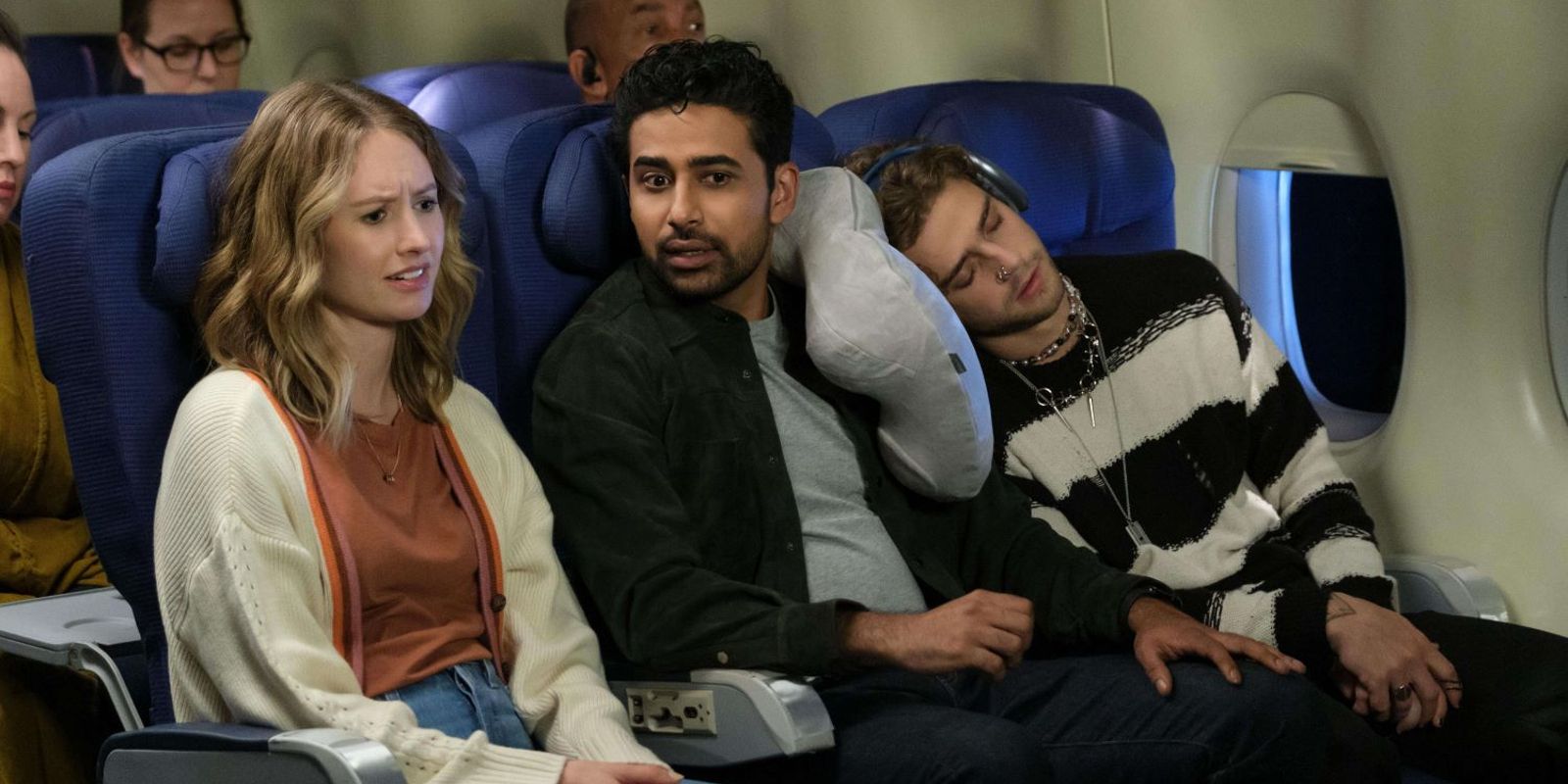 Little Toastie lays on Sid&rsquo;s arm while Taylor and Sid talk on a plane.