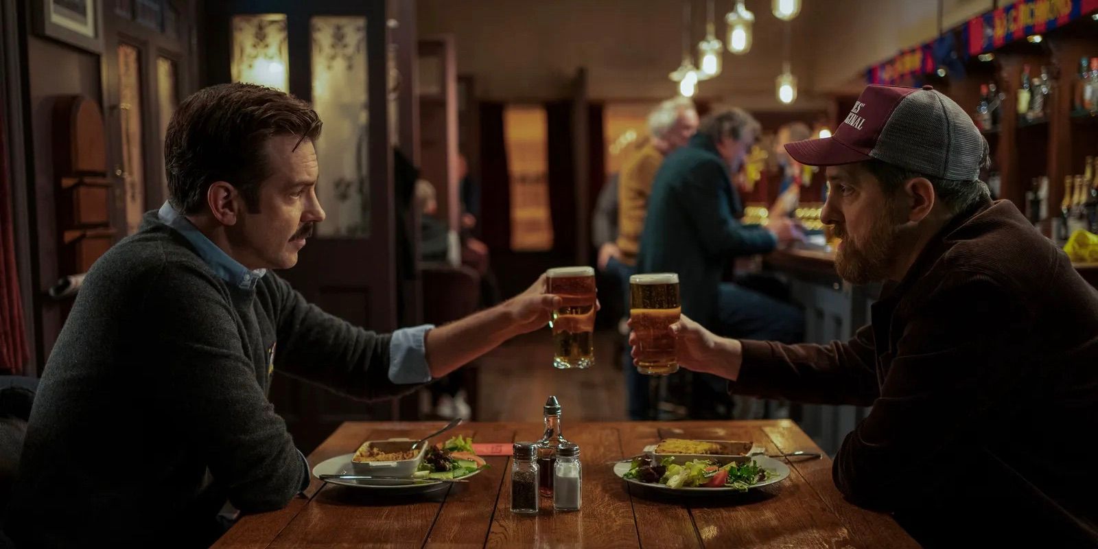 Ted and Beard share a beer in the pub in Ted Lasso