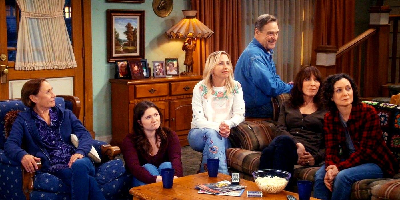 The Conners family sitting around the couch in a cabin in the sitcom