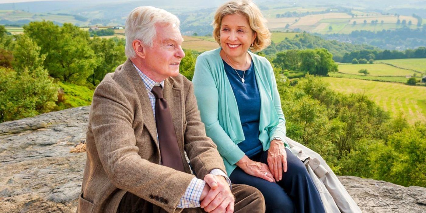 The couple sitting on a rock in Last Tango in Halifax