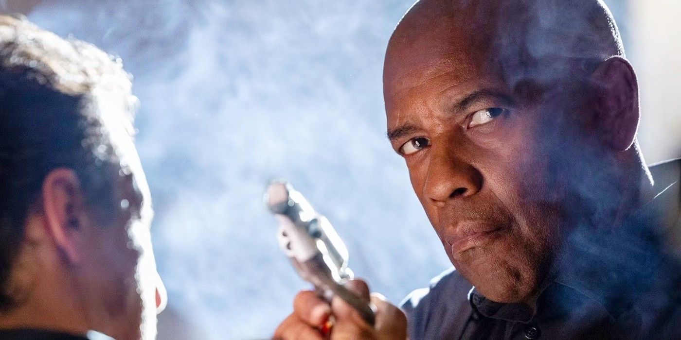 Denzel Washington as Robert McCall holding a gun and looking serious l in The Equalizer 3