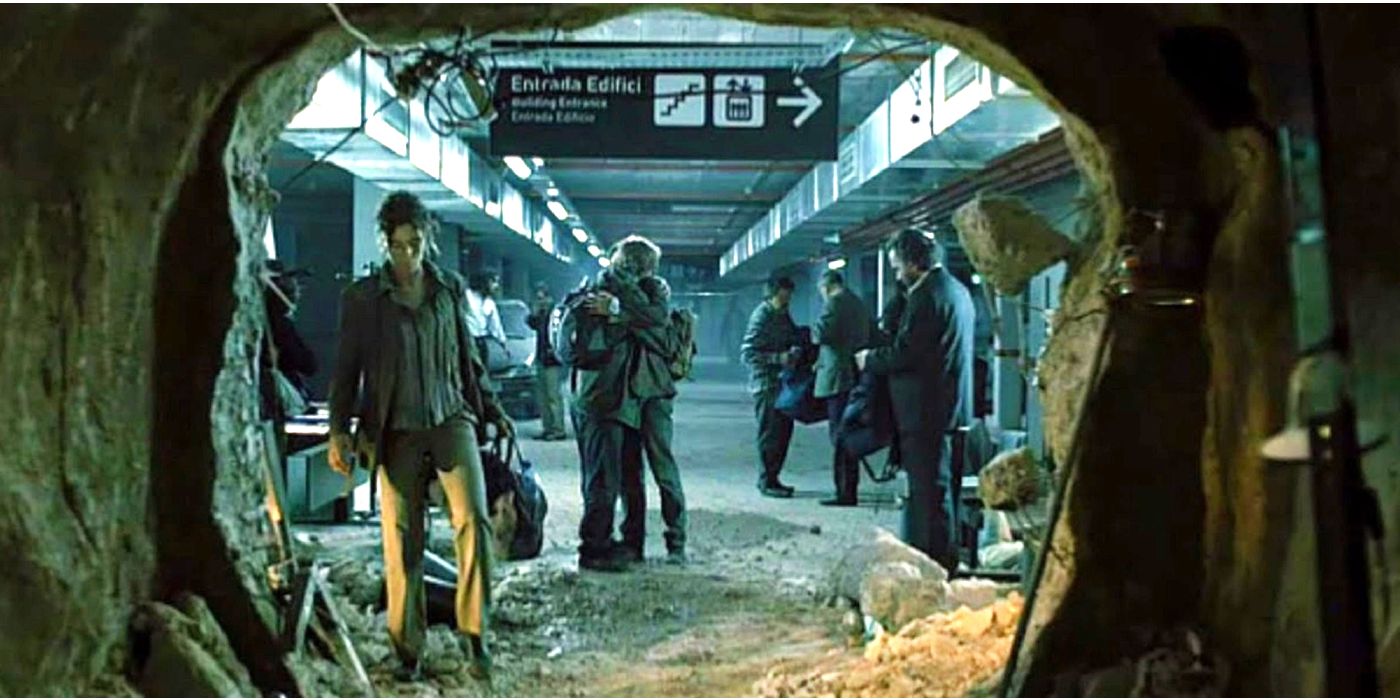 People hug and stand by a cave in the train station.