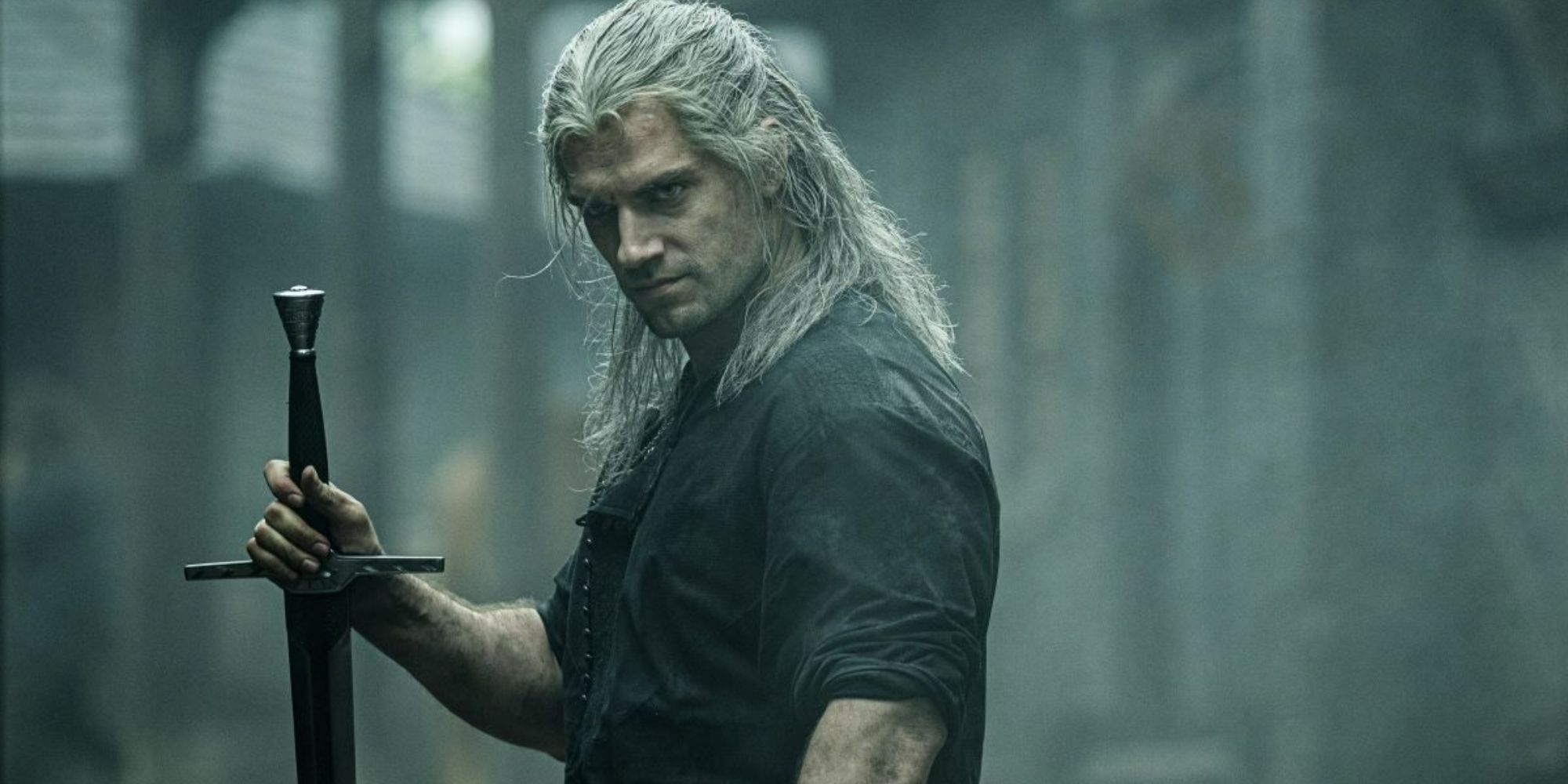 Iconic image of Geralt of Rivia holding a sword in The Witcher