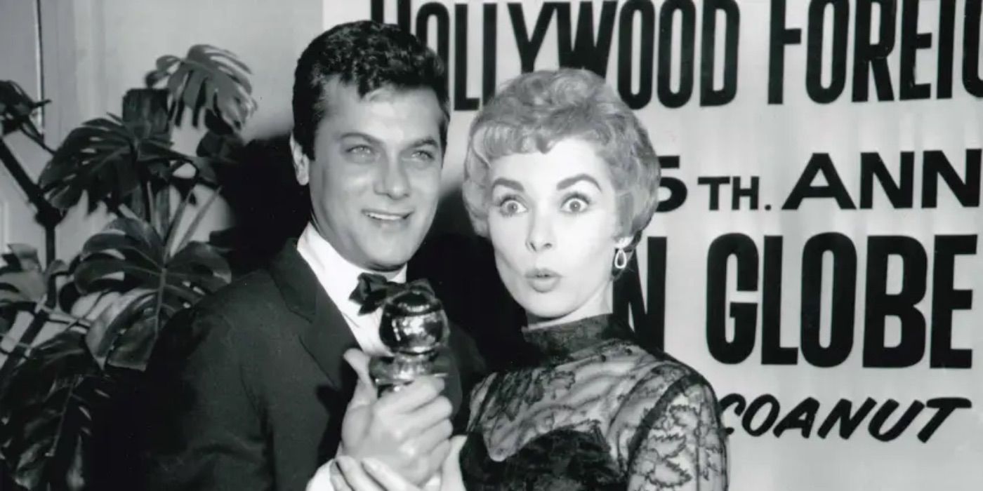 Tony Curtis and Janet Leigh hold a Golden Globe Award