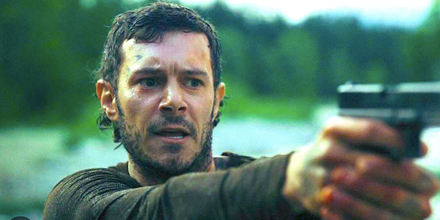 Trevor aims a gun in River Wild 2023