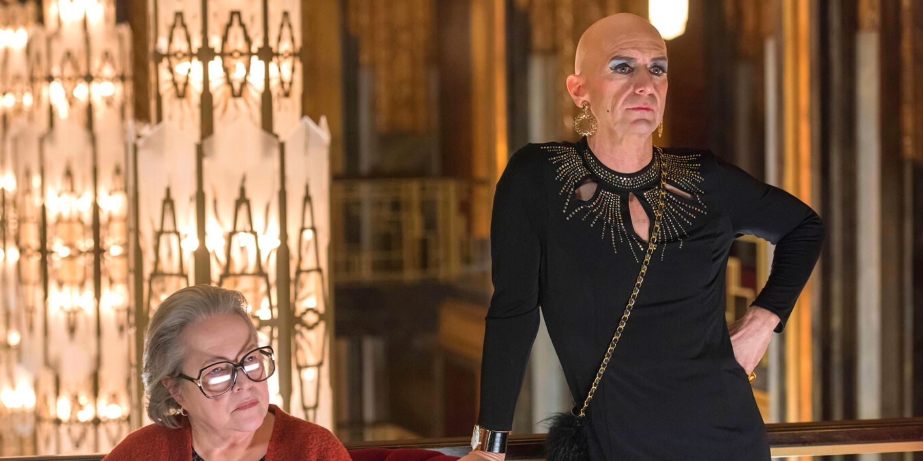 Denis O'Hare as Liz Taylor and Kathy Bates as Iris in the lobby in American Horror Story: Hotel