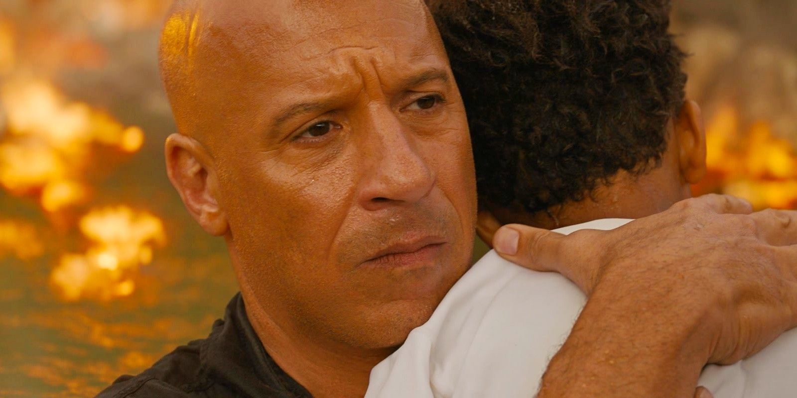 Vin Diesel looking sad while hugging his son in Fast X