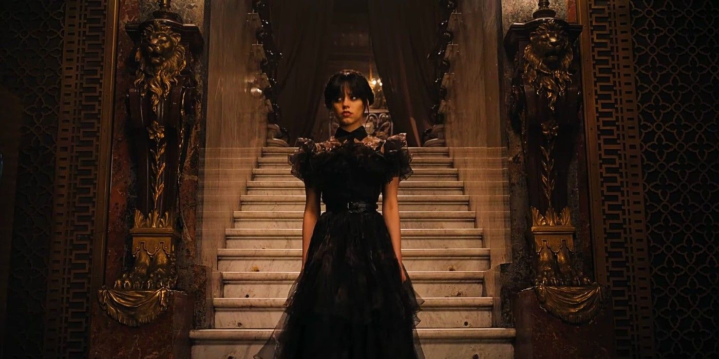 Wednesday Addams (Jenna Ortega), in a black dress, is descending a staircase on Wednesday