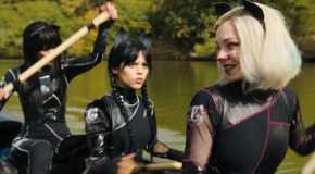 Wednesday (Jenna Ortega) and Enid (Emma Myers) participate in the Poe Cup in Wednesday.