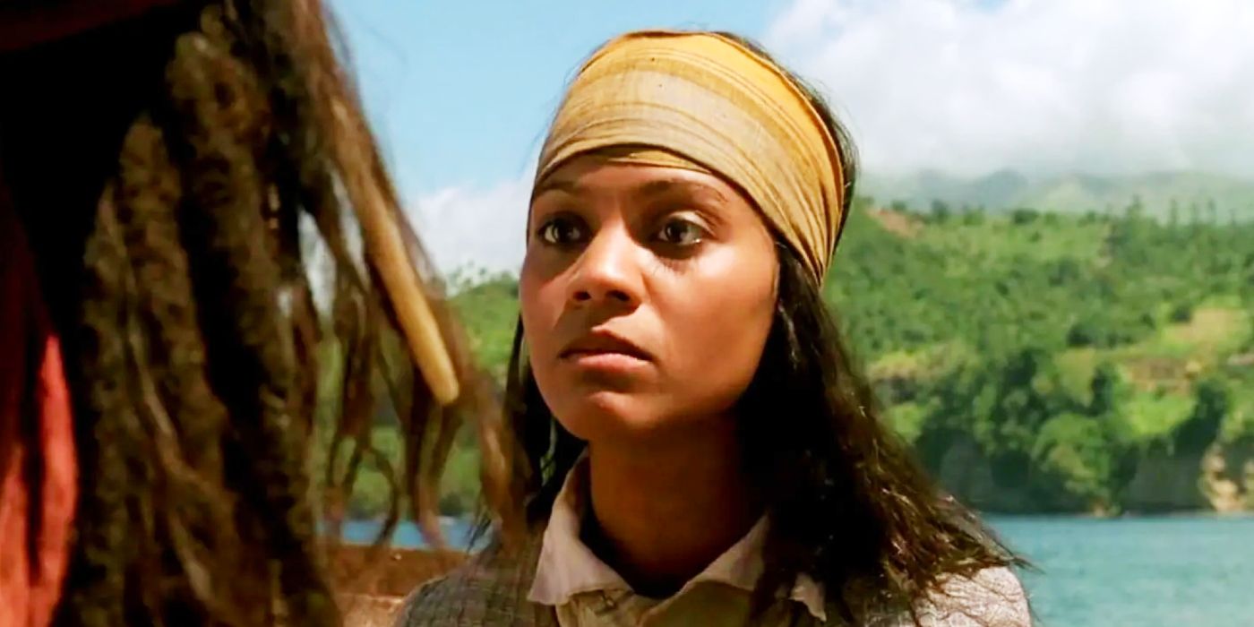 Zoe Saldana as Anamaria looking stoically on the deck in Pirates of the Caribbean: The Curse of the Black Pearl.
