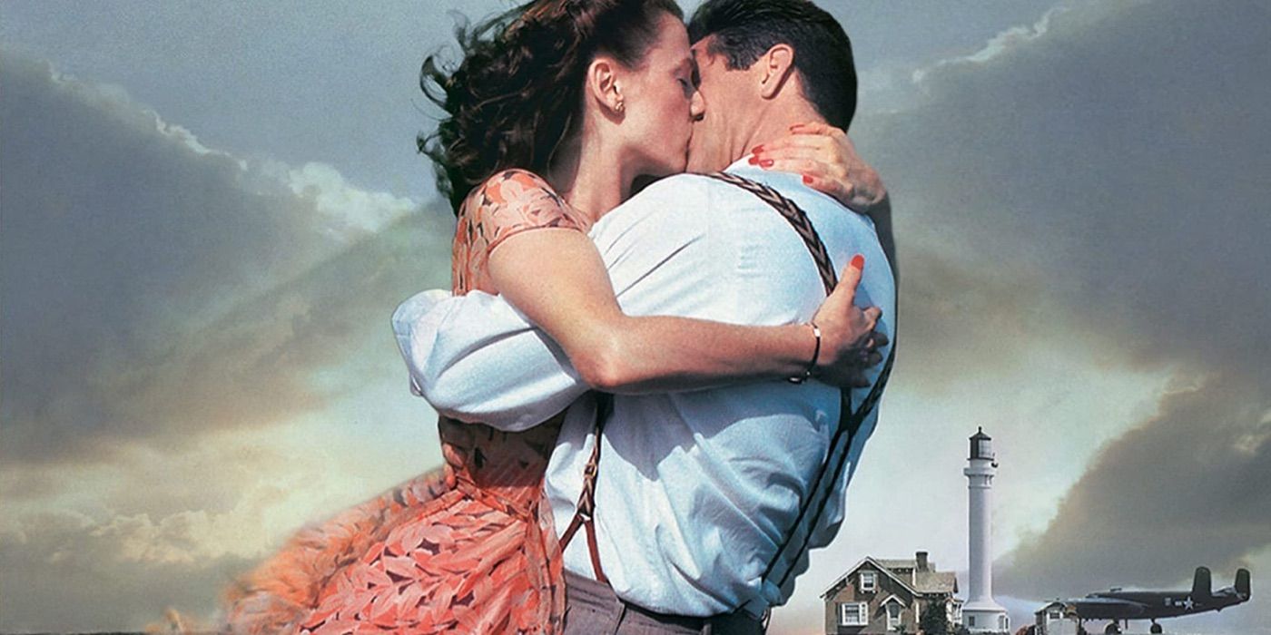A man and woman kiss by the sea in Forever Young