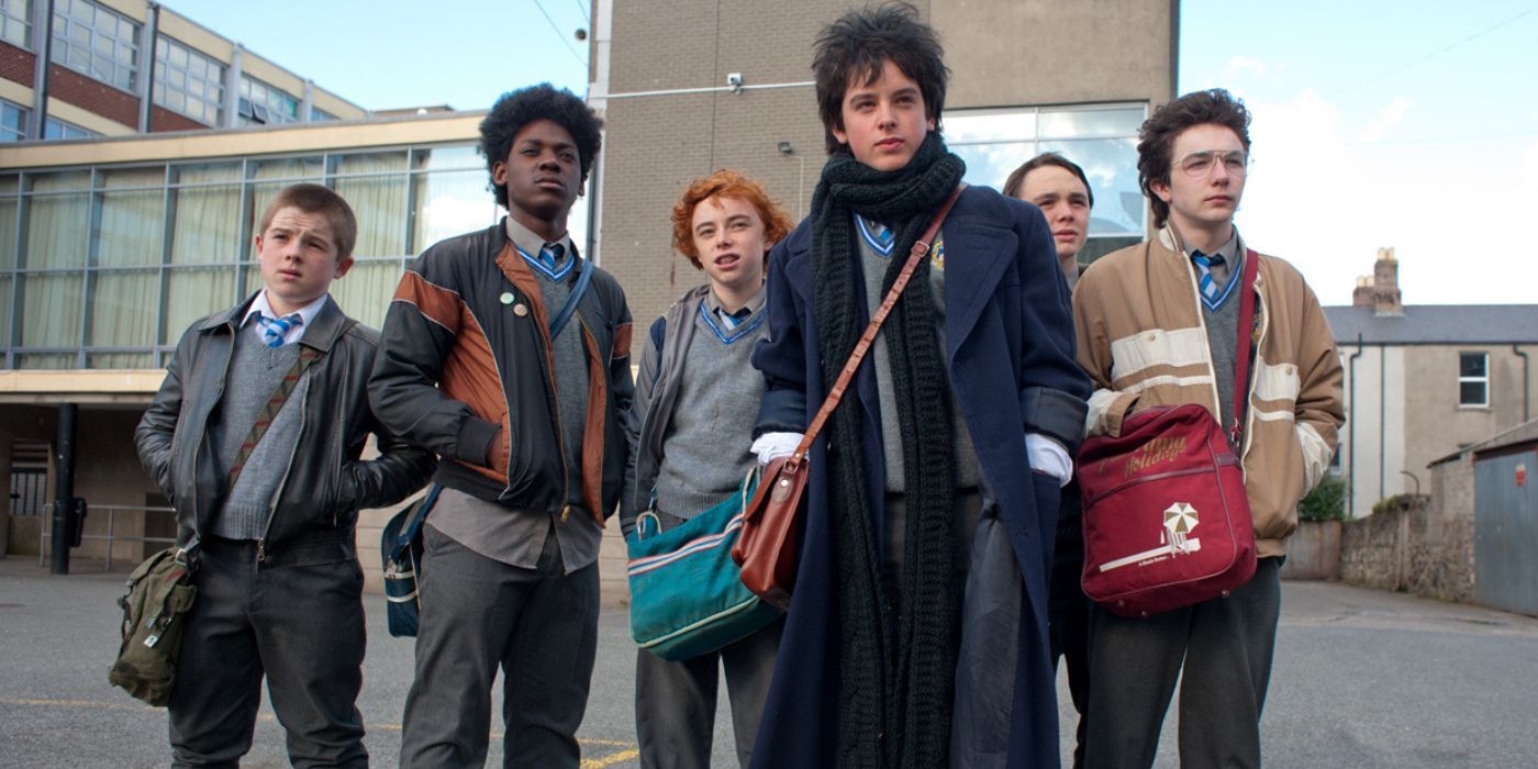 A group of friends standing together in a still from Sing Street
