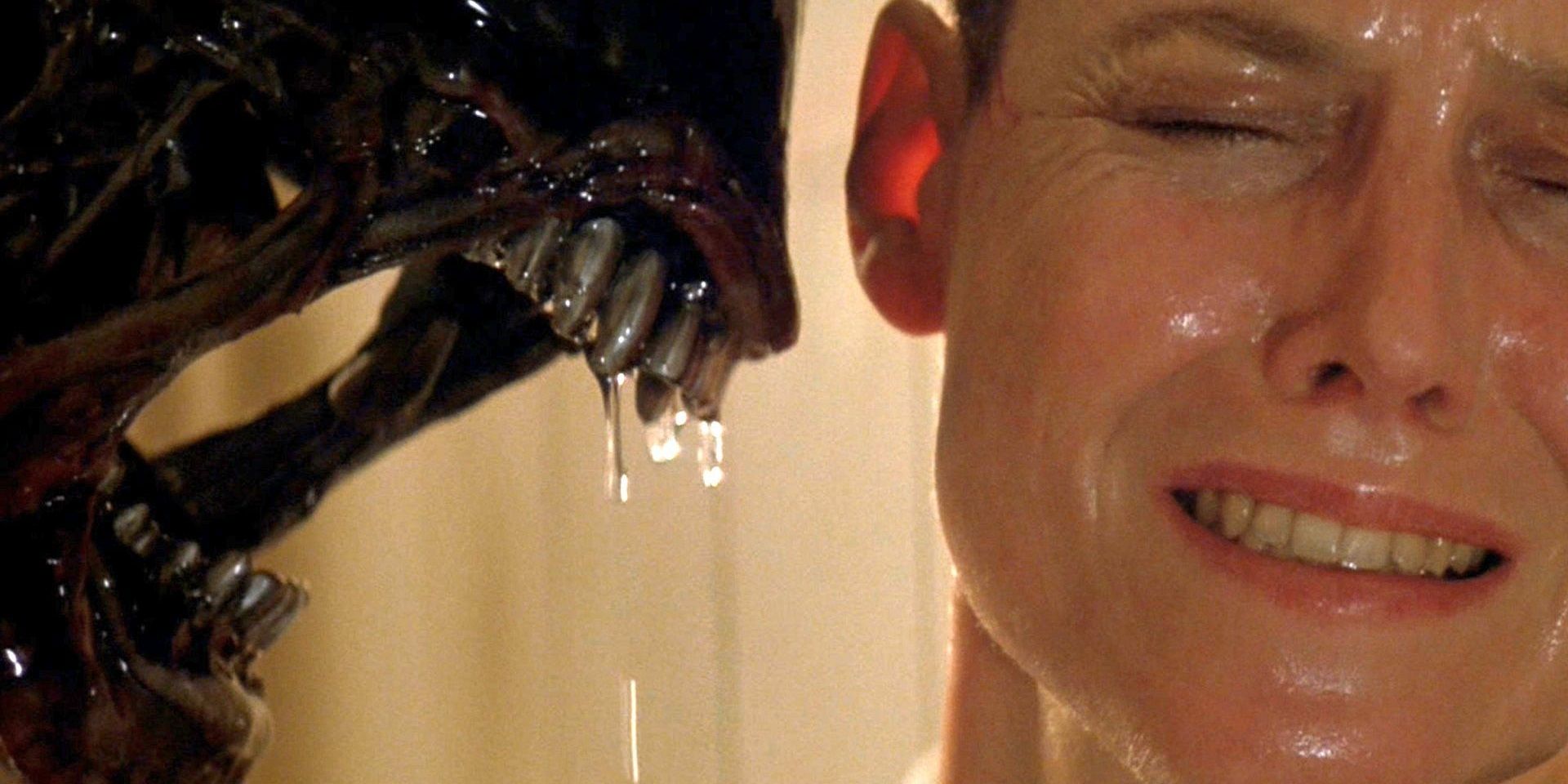 A Xenomorph encounters a frightened Ripley (Sigourney Weaver) at close range in Alien 3