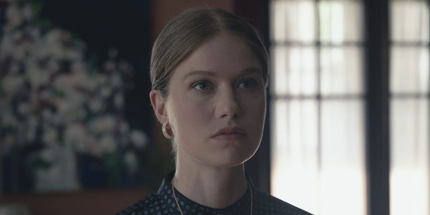 Alanis Wheeler in a black dress in The Handmaid’s Tale.