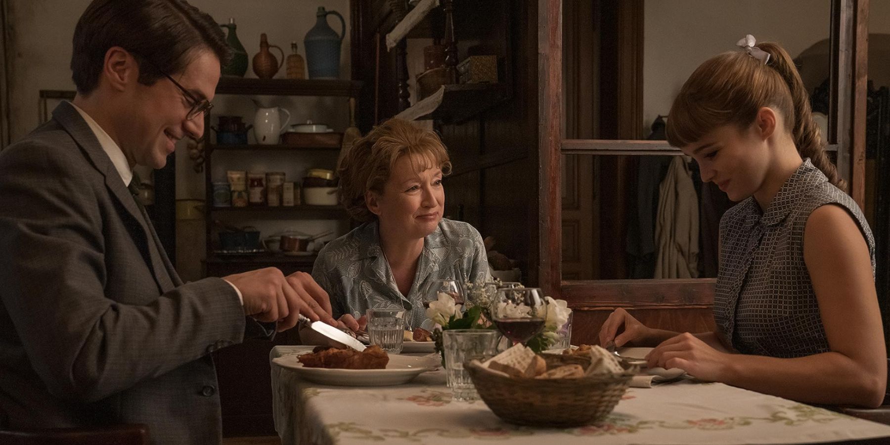 Alba Baptista in the dinner scene of Mrs Harris Goes to Paris