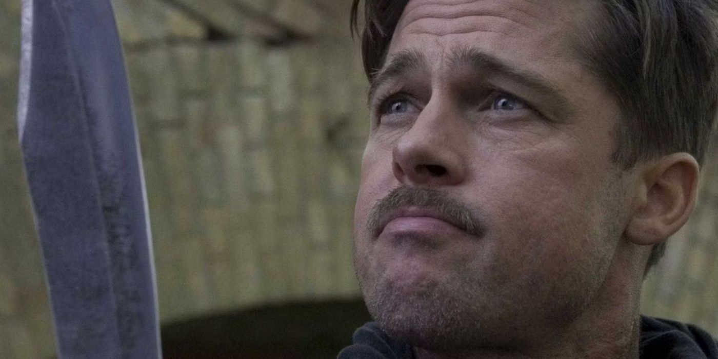 Aldo Raine looking at his large knife in Inglourious Basterds